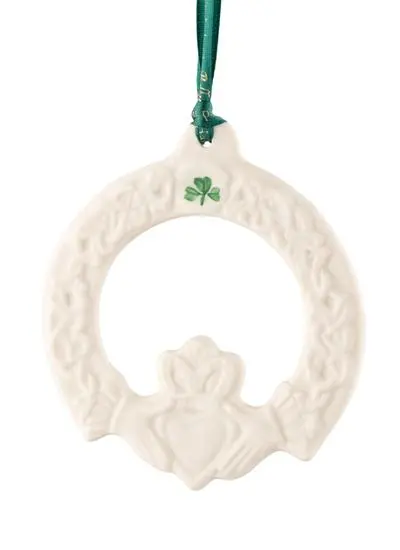 Claddagh Friendship Ornament with a green shamrock painted hanging from a green ribbon isolated on a white background